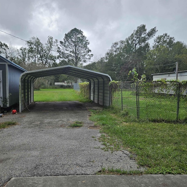 view of vehicle parking featuring a carport and a lawn