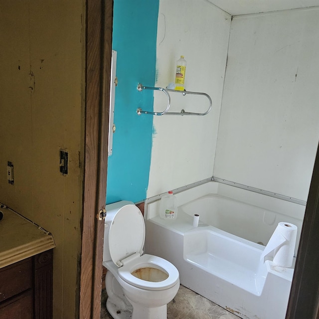 bathroom featuring a bathing tub and toilet