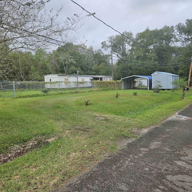 view of yard with a carport