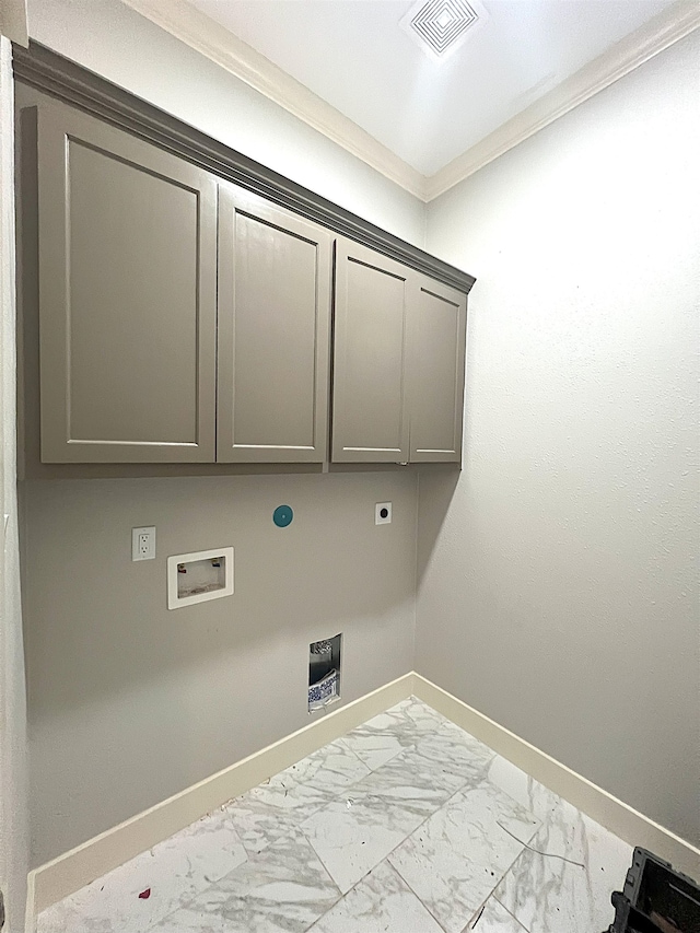 clothes washing area featuring washer hookup, cabinets, crown molding, and electric dryer hookup