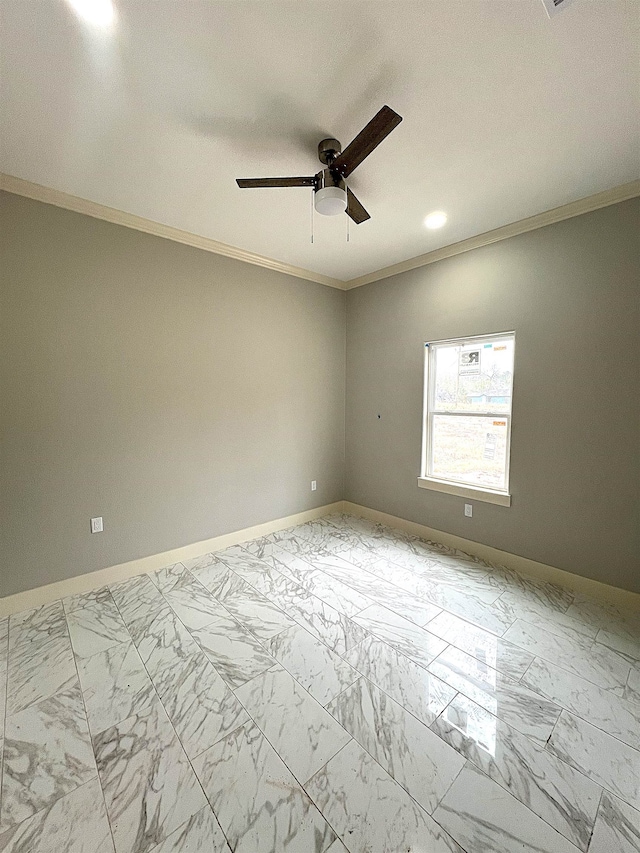 empty room featuring ceiling fan and ornamental molding