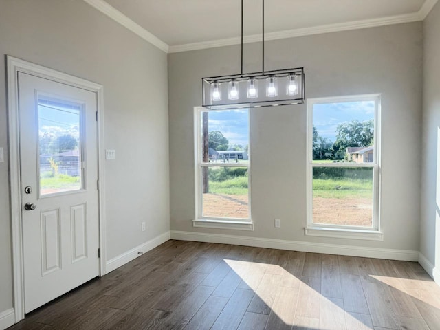 unfurnished dining area with crown molding and dark wood-type flooring