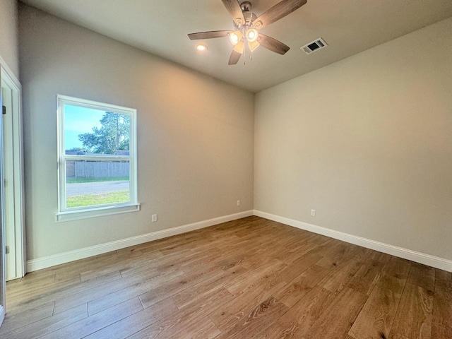 unfurnished room featuring ceiling fan and light wood-type flooring