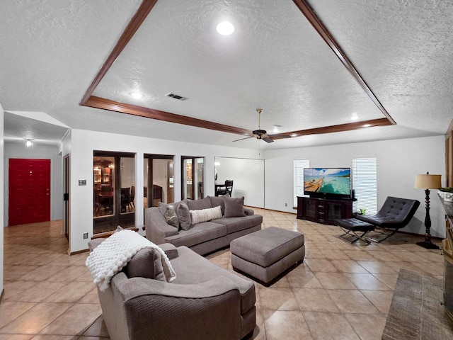 1940 Sams Way, Beaumont, TX 77706 - living room featuring a raised ceiling, a textured ceiling, light tile patterned flooring, recessed lighting, and a ceiling fan