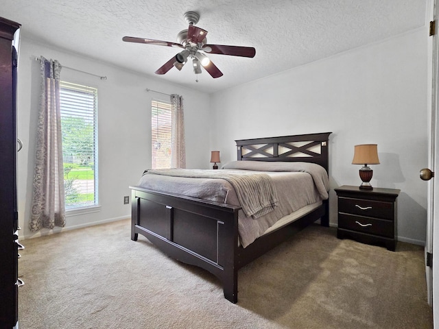 1940 Sams Way, Beaumont, TX 77706 - bedroom featuring carpet flooring, a textured ceiling, and a ceiling fan