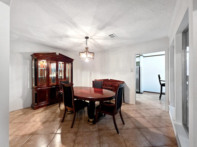 1940 Sams Way, Beaumont, TX 77706 - dining room with a chandelier and a textured ceiling