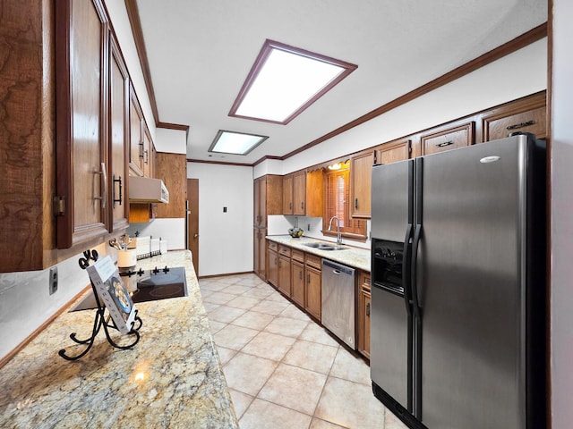 1940 Sams Way, Beaumont, TX 77706 - kitchen with appliances with stainless steel finishes, under cabinet range hood, crown molding, light tile patterned floors, and brown cabinets