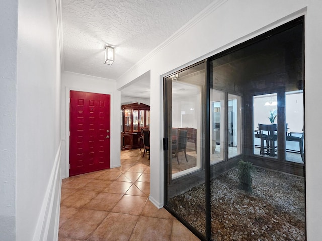 1940 Sams Way, Beaumont, TX 77706 - hallway featuring a textured ceiling, ornamental molding, and tile patterned flooring