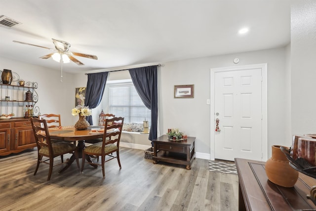 dining area featuring light hardwood / wood-style floors and ceiling fan