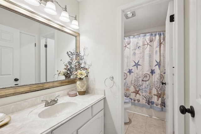 bathroom with tile patterned floors, toilet, and vanity