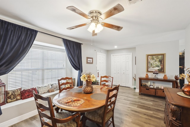 dining space featuring hardwood / wood-style floors and ceiling fan