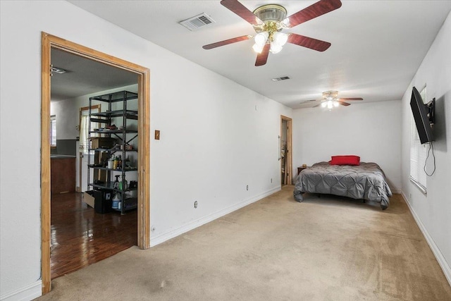 unfurnished bedroom featuring carpet and ceiling fan