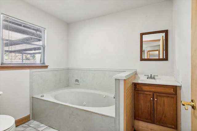 bathroom with vanity, toilet, and a bathing tub