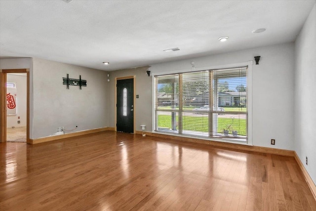 empty room featuring hardwood / wood-style floors