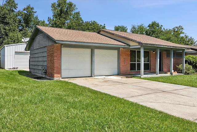 single story home with a front yard and a garage