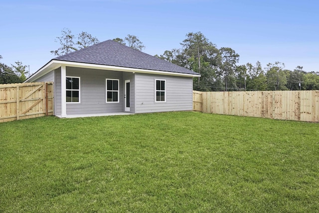 9896 Golden Ln, Lumberton, TX 77657 - rear view of property with roof with shingles and a fenced backyard