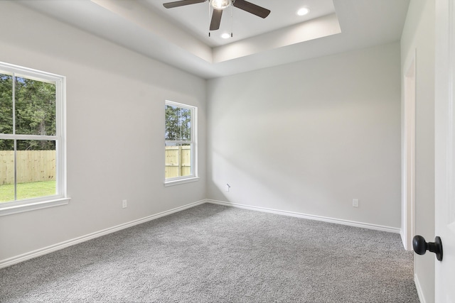 9896 Golden Ln, Lumberton, TX 77657 - carpeted empty room with ceiling fan, recessed lighting, and a tray ceiling