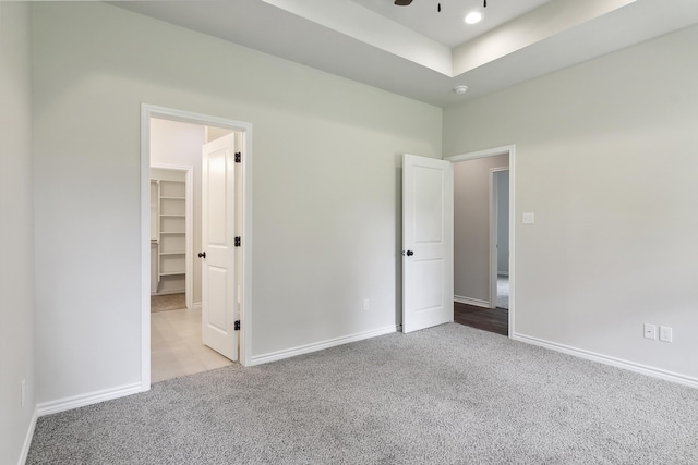 9896 Golden Ln, Lumberton, TX 77657 - unfurnished bedroom with carpet flooring and a walk in closet