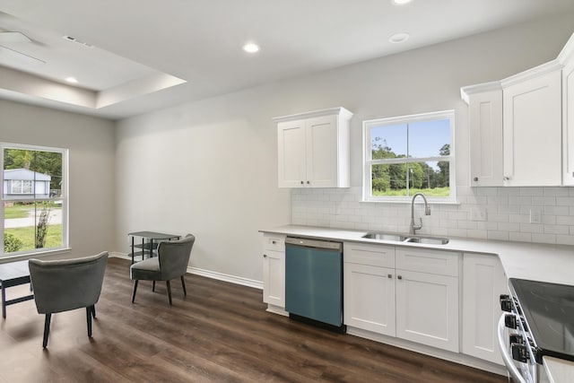 9896 Golden Ln, Lumberton, TX 77657 - kitchen featuring dishwashing machine, range, decorative backsplash, white cabinets, and dark wood-style flooring