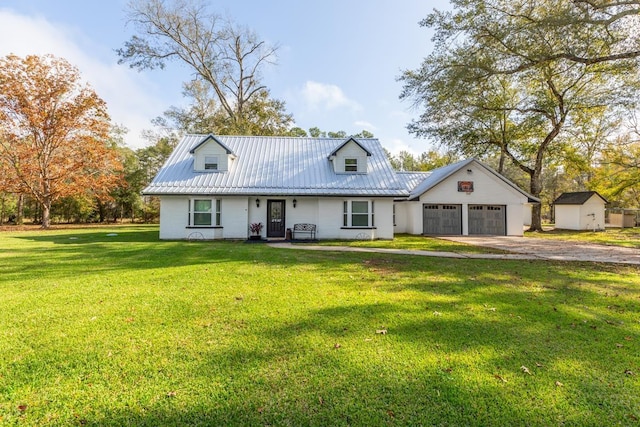 cape cod house featuring a front lawn and a garage