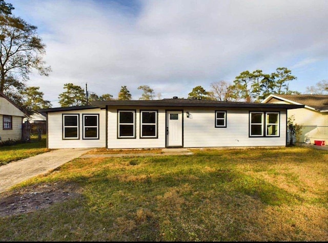 5260 Landry Ln, Beaumont, TX 77708 - view of front of home with a front lawn