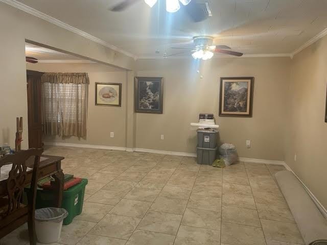 interior space featuring ceiling fan and ornamental molding