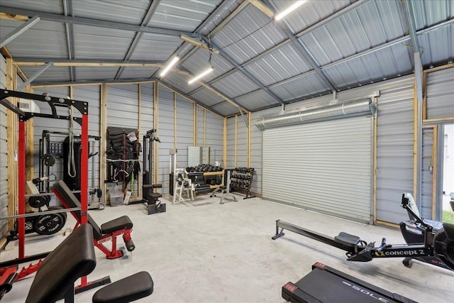 2801 Magnolia Ln, Groves, TX 77619 - exercise room with metal wall, a garage, and vaulted ceiling