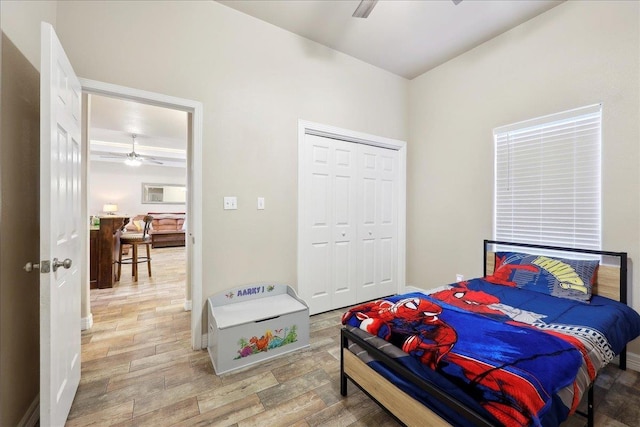 2801 Magnolia Ln, Groves, TX 77619 - bedroom with a closet, baseboards, and light wood-type flooring