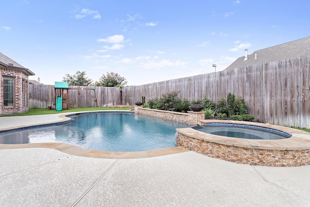6526 Brayfield Ln, Beaumont, TX 77706 - view of swimming pool featuring a fenced backyard, a pool with connected hot tub, and a patio area