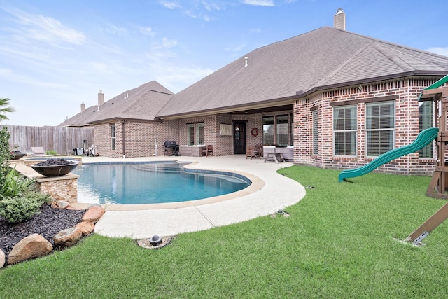 6526 Brayfield Ln, Beaumont, TX 77706 - view of swimming pool featuring a patio, area for grilling, and a playground