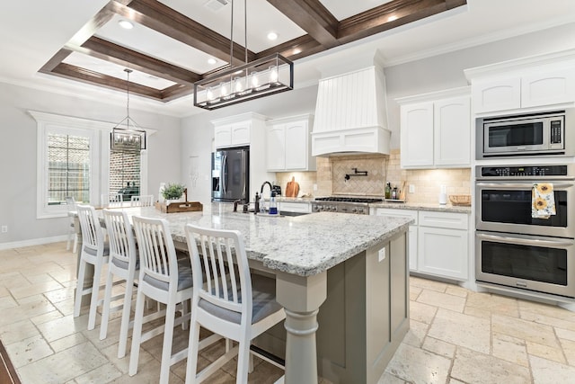 6526 Brayfield Ln, Beaumont, TX 77706 - kitchen featuring stainless steel appliances, custom exhaust hood, stone tile flooring, tasteful backsplash, and ornamental molding