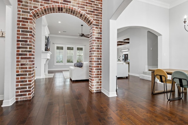 6526 Brayfield Ln, Beaumont, TX 77706 - foyer with a ceiling fan, dark wood finished floors, arched walkways, crown molding, and recessed lighting
