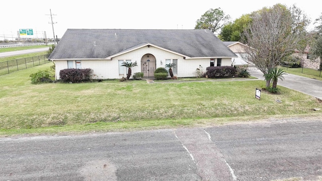 ranch-style house with a front lawn