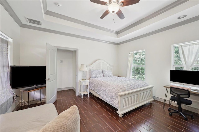 4592 Shakespeare Ln, Kountze, TX 77625 - bedroom with a raised ceiling, crown molding, dark wood-style floors, a desk, and a ceiling fan