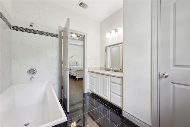 4592 Shakespeare Ln, Kountze, TX 77625 - ensuite bathroom with vanity and tile patterned flooring