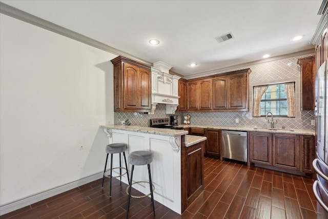 4592 Shakespeare Ln, Kountze, TX 77625 - kitchen featuring dishwasher, range with electric cooktop, a peninsula, decorative backsplash, and recessed lighting