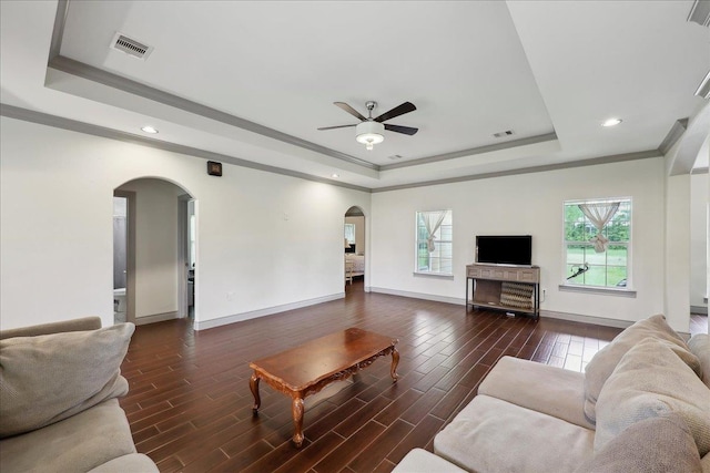 4592 Shakespeare Ln, Kountze, TX 77625 - living area with arched walkways, a raised ceiling, ceiling fan, recessed lighting, and wood finished floors
