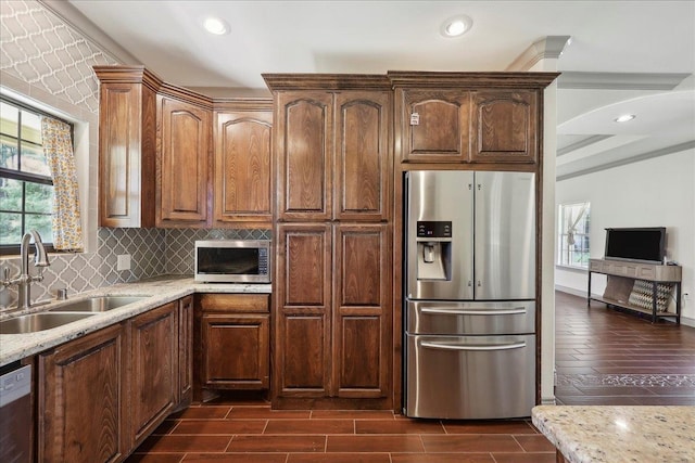 4592 Shakespeare Ln, Kountze, TX 77625 - kitchen featuring stainless steel appliances, plenty of natural light, tasteful backsplash, light stone countertops, and recessed lighting