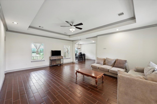 4592 Shakespeare Ln, Kountze, TX 77625 - living room with a raised ceiling, ceiling fan, ornamental molding, recessed lighting, and dark wood-type flooring