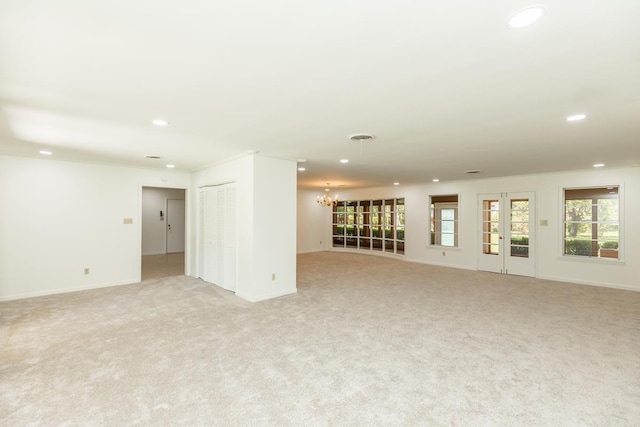 515 Watts Rd, Silsbee, TX 77656 - empty room with recessed lighting, a chandelier, light carpet, and healthy amount of natural light