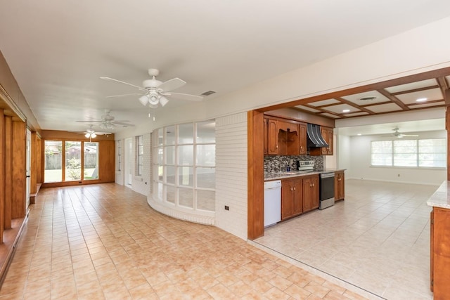 515 Watts Rd, Silsbee, TX 77656 - kitchen featuring ceiling fan, open floor plan, dishwasher, and brown cabinets