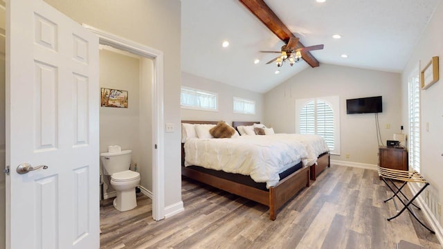 bedroom featuring connected bathroom, lofted ceiling with beams, ceiling fan, and wood-type flooring