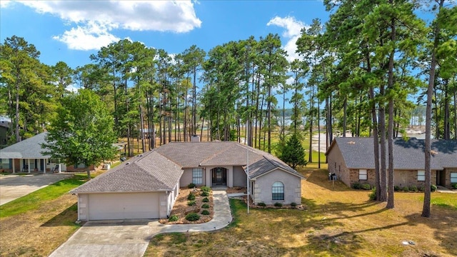 view of front of house with a front lawn and a garage