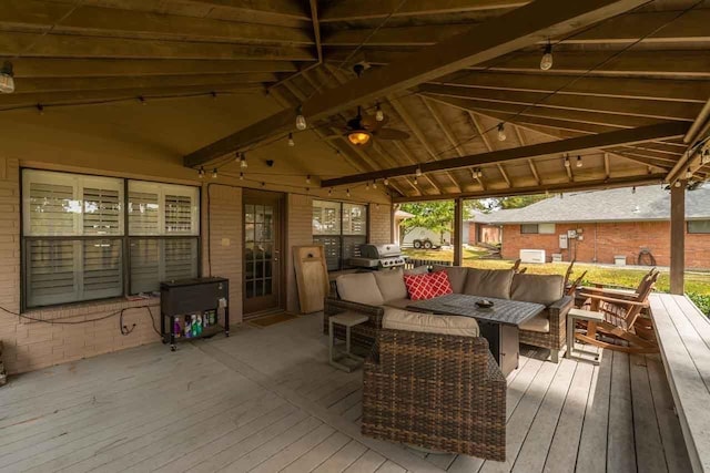 wooden deck with an outdoor living space and grilling area