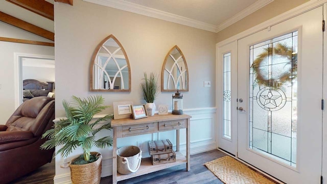 foyer entrance with lofted ceiling, a healthy amount of sunlight, ornamental molding, and dark wood-type flooring