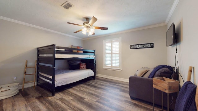 bedroom featuring a textured ceiling, ceiling fan, dark hardwood / wood-style floors, and crown molding