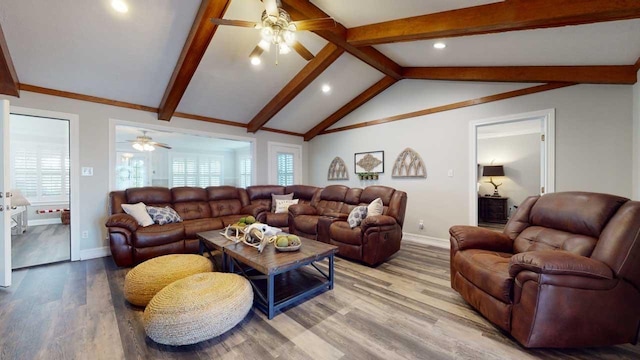 living room with ceiling fan, hardwood / wood-style floors, and lofted ceiling with beams