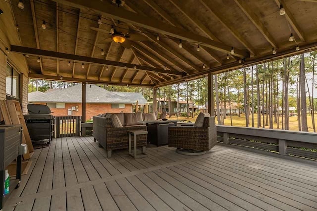 deck with a gazebo, an outdoor living space, and a grill