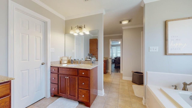 bathroom with tile patterned floors, vanity, a bathtub, and crown molding