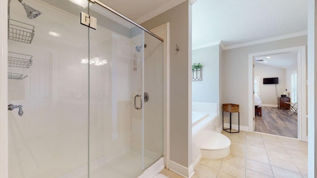 bathroom with tile patterned floors, separate shower and tub, and ornamental molding